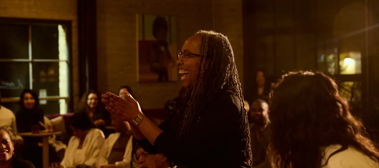 Audience applauding at the Collective Conversations event with Fredrika Newton