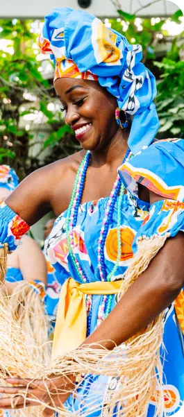 Dancer in traditional dress performing at the Equity & Justice Symposium